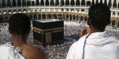 Muslim pilgrims praying infront of the Kabah at the Sacred Mosque in Makkah, towards which all Muslims face when they pray.